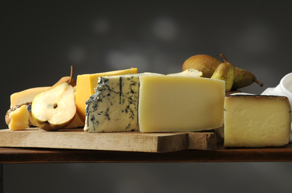 slices of different cheeses with pears